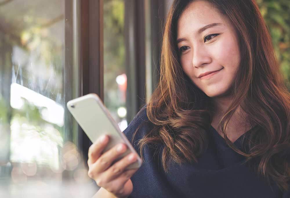 Woman looking at her smart phone
