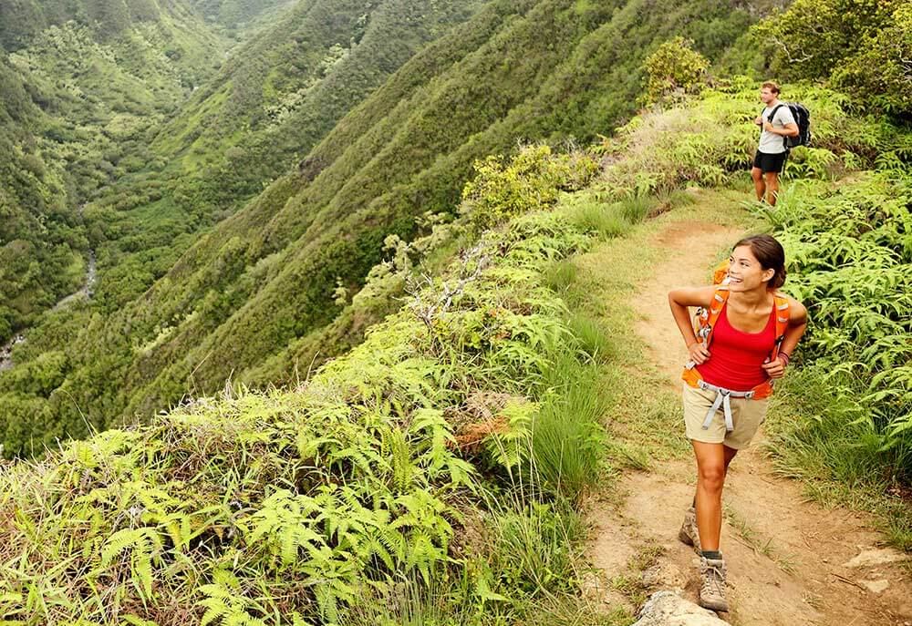 Couple hiking through a tropical mountain