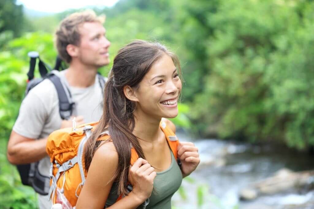 Couple on a hike next to a river