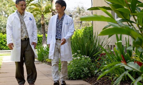 two neurologists walking outside