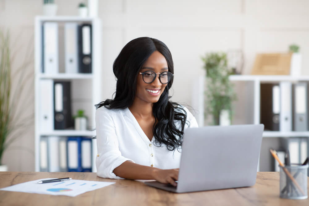 Woman at computer researching urgent care